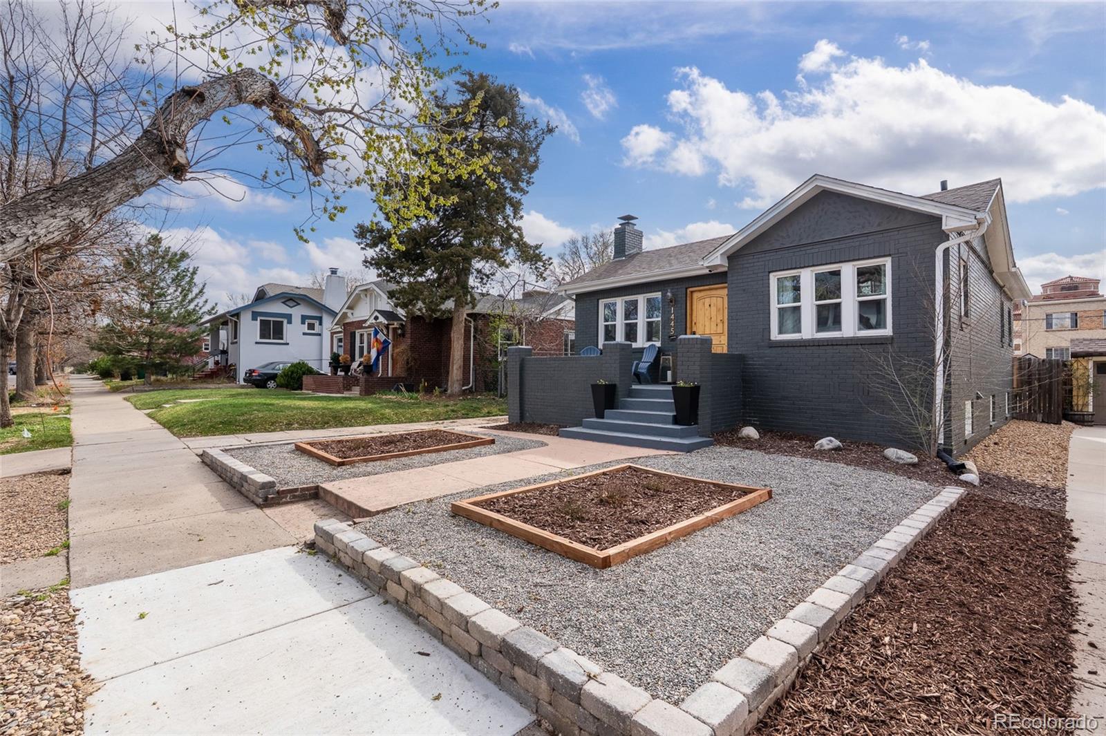 1445 Ash Street Denver, CO 80220 - Photo 41 of 45 a view of a house with a yard