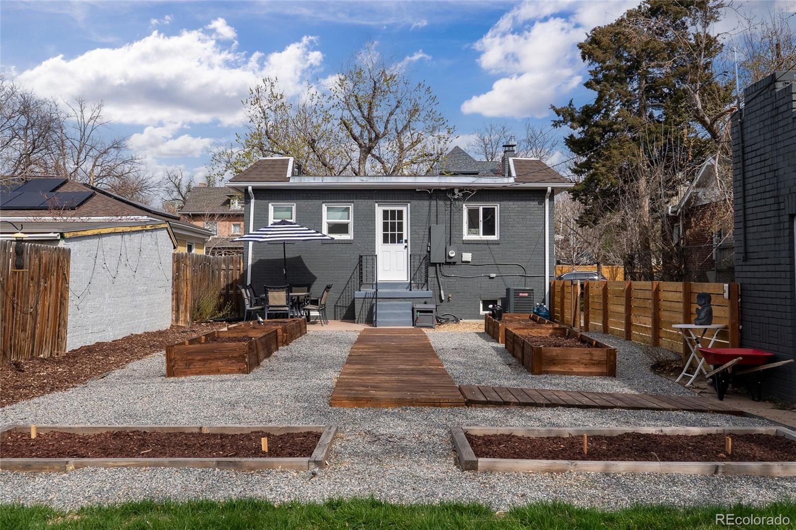 1445 Ash Street Denver, CO 80220 - Photo 42 of 45 a front view of a house with patio
