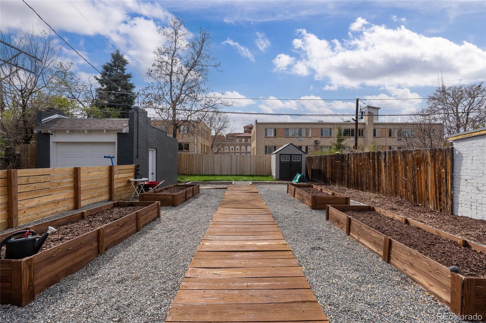 1445 Ash Street Denver, CO 80220 - Photo 44 of 45 a view of a backyard with sitting area