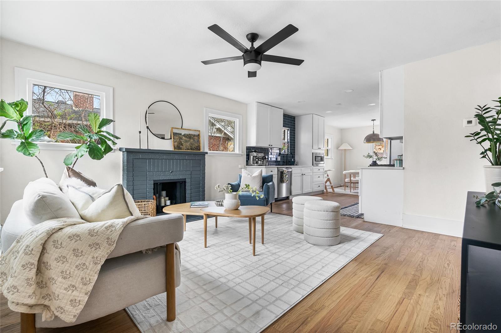1445 Ash Street Denver, CO 80220 - Photo 5 of 45 a living room with furniture and a fireplace