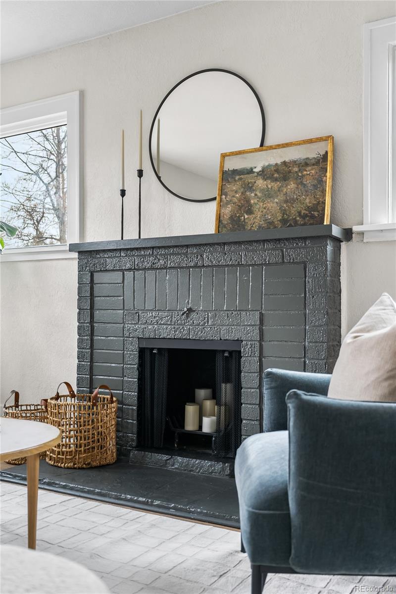1445 Ash Street Denver, CO 80220 - Photo 7 of 45 a living room with furniture and a fireplace