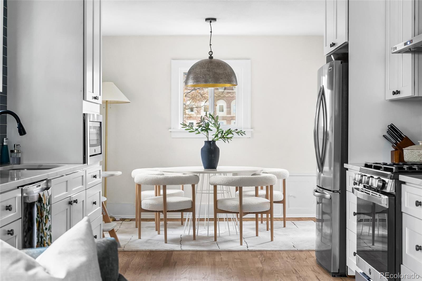 1445 Ash Street Denver, CO 80220 - Photo 9 of 45 a dining room with furniture and window
