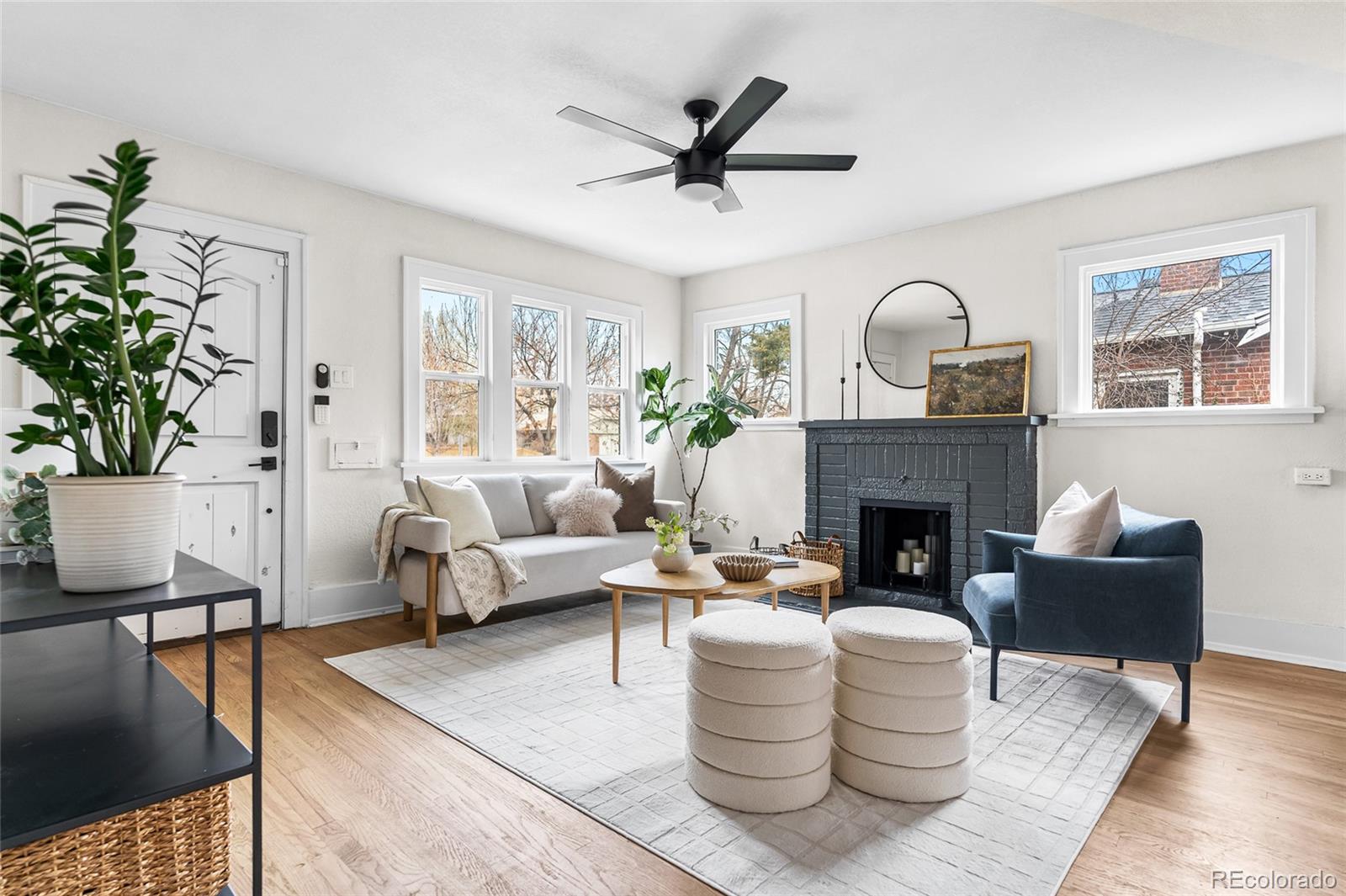 1445 Ash Street Denver, CO 80220 - Photo 10 of 45 a living room with furniture and a fireplace