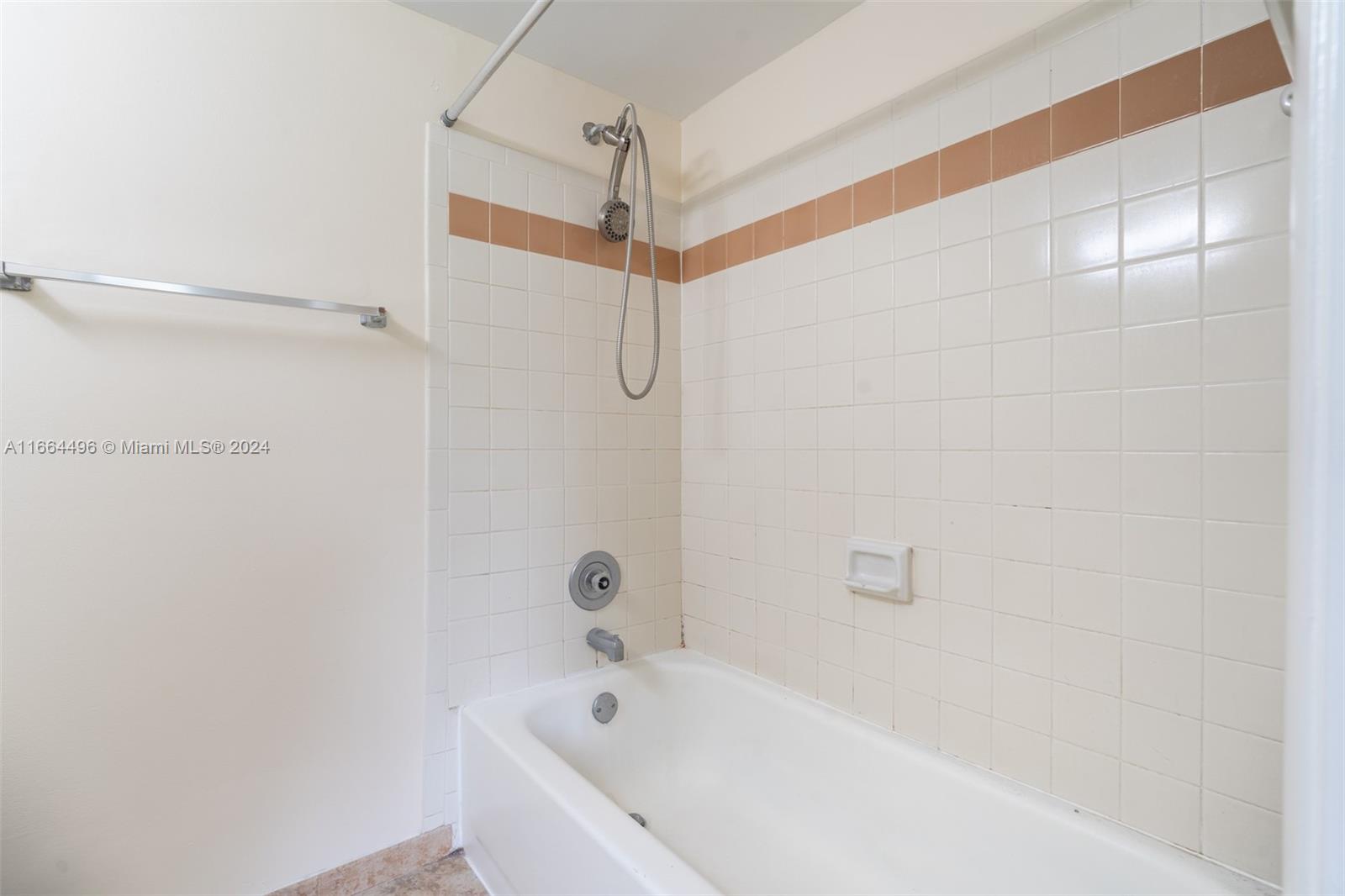 5672 Rock Island Road, Unit 259 Tamarac, FL 33319 - Photo 11 of 31 a bathroom with a bathtub and shower