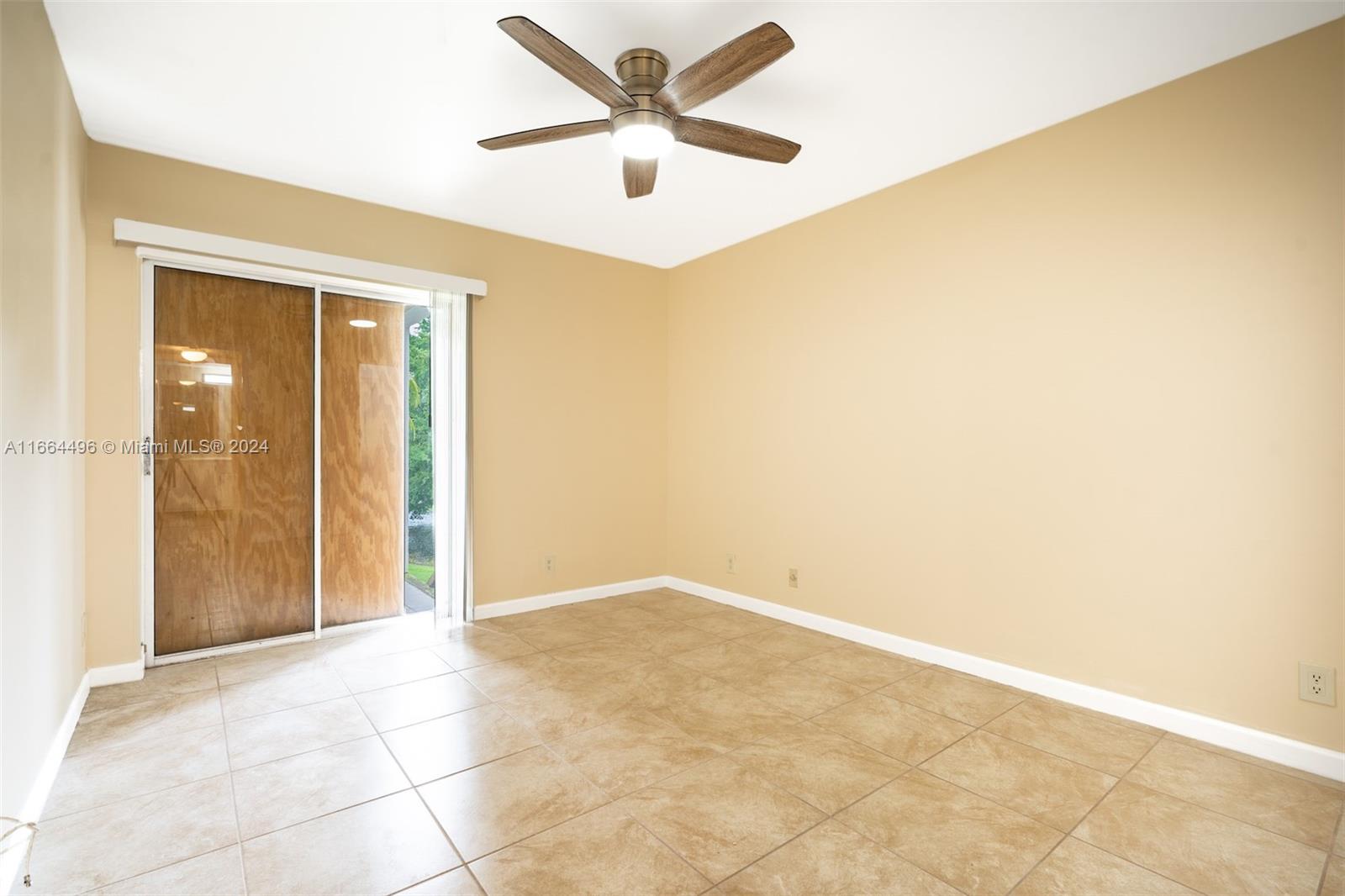 5672 Rock Island Road, Unit 259 Tamarac, FL 33319 - Photo 16 of 31 an empty room with closet and fan
