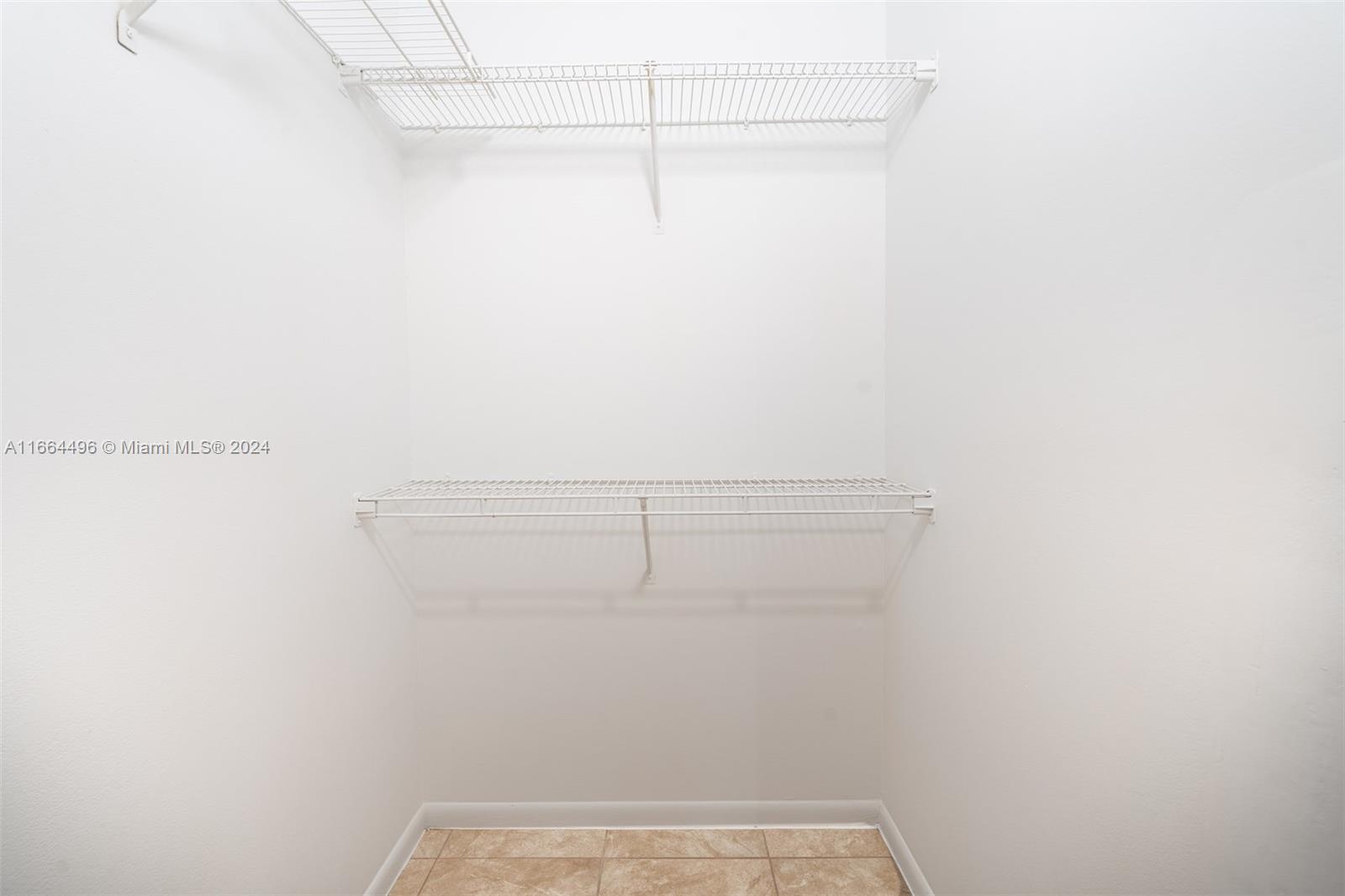 5672 Rock Island Road, Unit 259 Tamarac, FL 33319 - Photo 18 of 31 a view of a room with racks on the wall