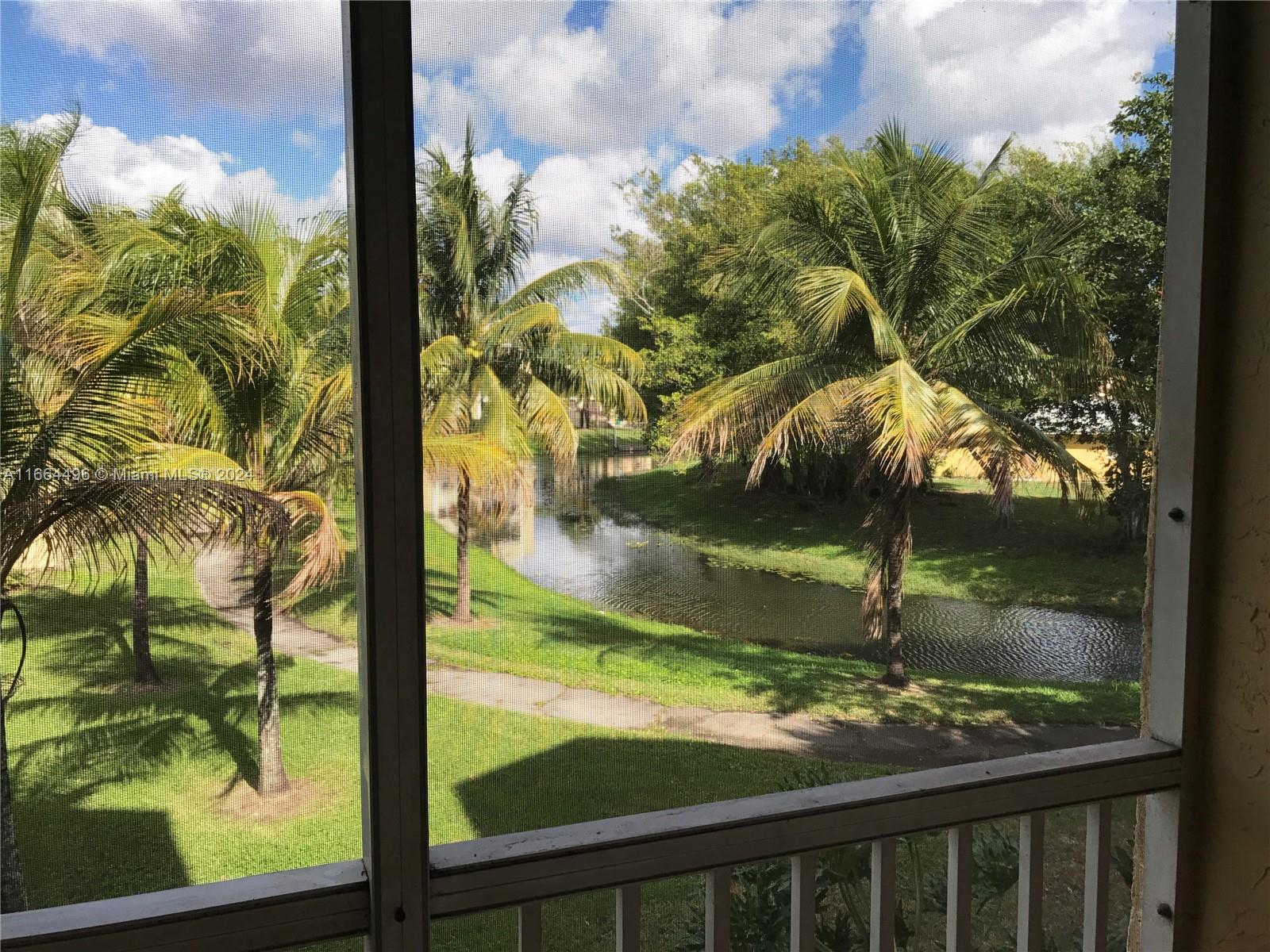 5672 Rock Island Road, Unit 259 Tamarac, FL 33319 - Photo 7 of 31 a view of a yard