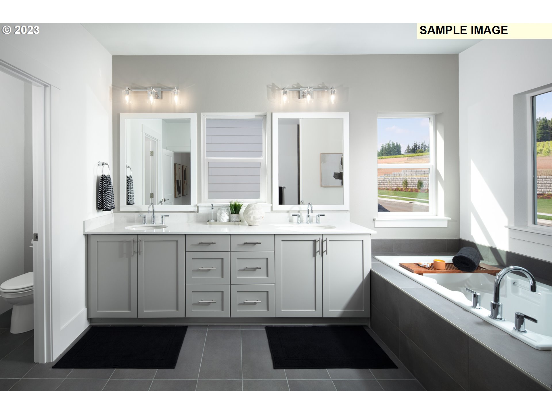17860 Southwest Maiden Court Beaverton, OR 97007 - Photo 11 of 23 a bathroom with a sink vanity granite tub and a mirror