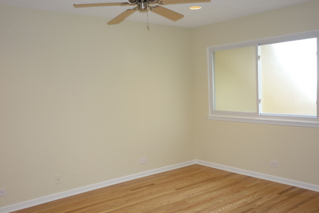 1261 Ranchview Court Buffalo Grove, IL 60089 - Photo 14 of 23 an empty room with a window and a fan