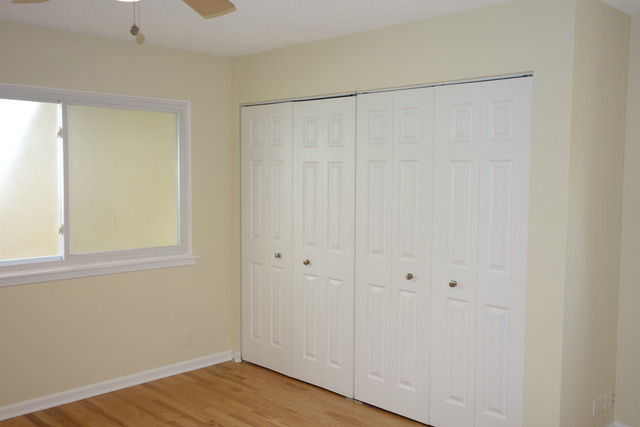 1261 Ranchview Court Buffalo Grove, IL 60089 - Photo 15 of 23 a view of an empty room with wooden floor and a window