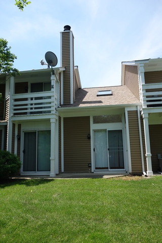 1261 Ranchview Court Buffalo Grove, IL 60089 - Photo 23 of 23 a front view of a house with garden