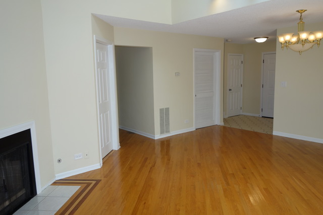1261 Ranchview Court Buffalo Grove, IL 60089 - Photo 6 of 23 a view of empty room with wooden floor