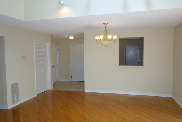 1261 Ranchview Court Buffalo Grove, IL 60089 - Photo 7 of 23 wooden floor in an empty room