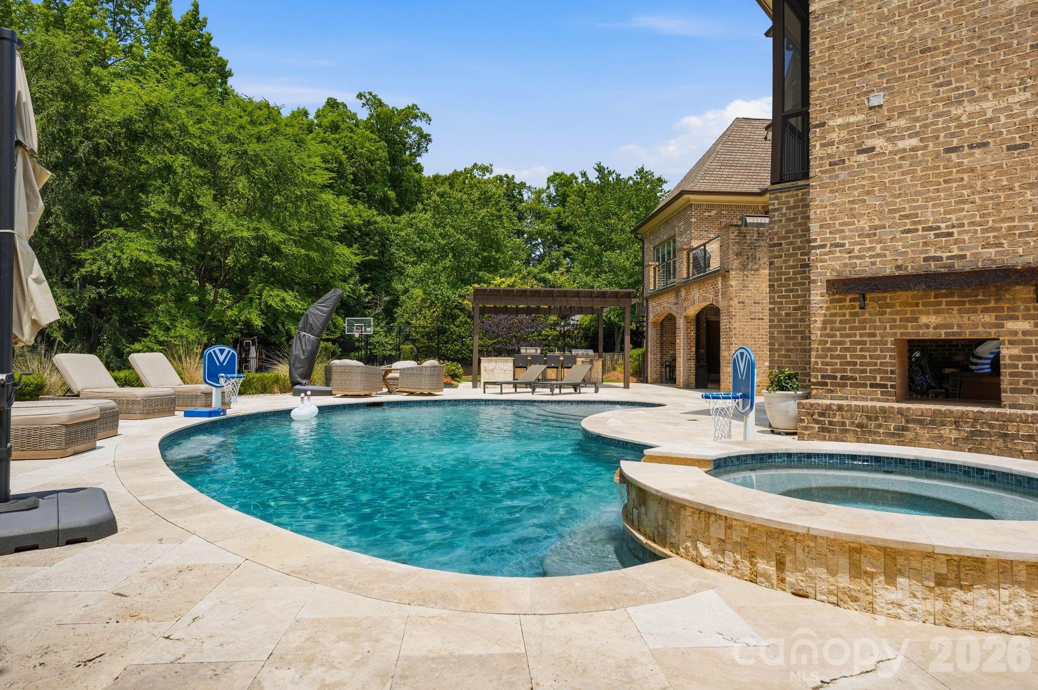7416 Lee Rea Road Charlotte, NC 28226 - Photo 12 of 48 a view of a swimming pool with a patio