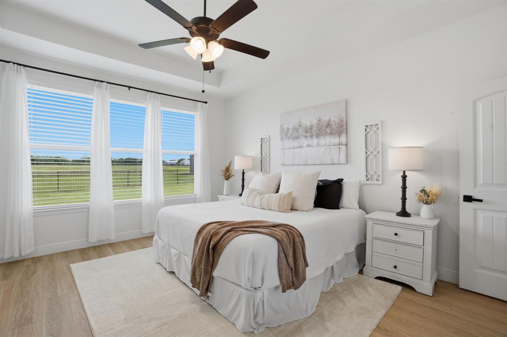773 Pennell Road Sherman, TX 75090 - Photo 17 of 29 The primary bedroom presents a serene & luxurious retreat, separated from the secondary bedrooms.