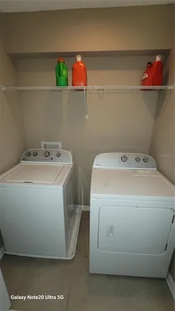 a utility room with dryer and washer