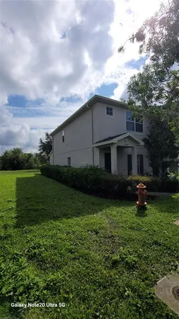 a view of a house with a yard