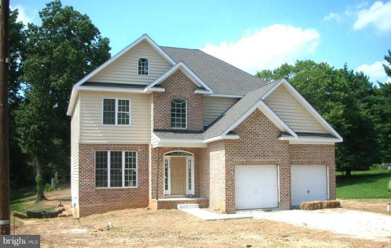 5304 Forge Road White Marsh, MD 21162 - Photo 1 of 6 a front view of a house with a yard