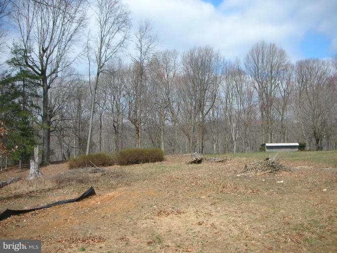 5304 Forge Road White Marsh, MD 21162 - Photo 2 of 6 a backyard of a house with lots of green space