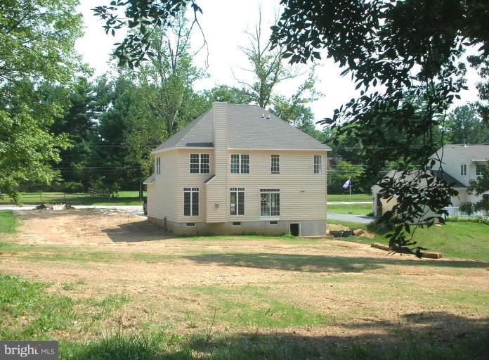 5304 Forge Road White Marsh, MD 21162 - Photo 6 of 6 a view of a house with a yard and large trees