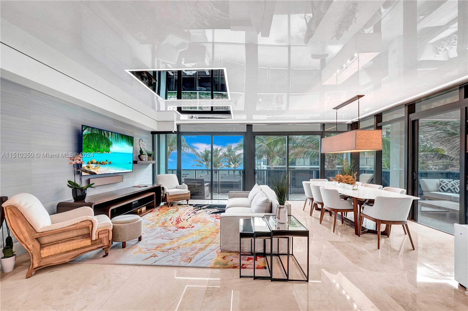 a outdoor living space with furniture and a flat screen tv