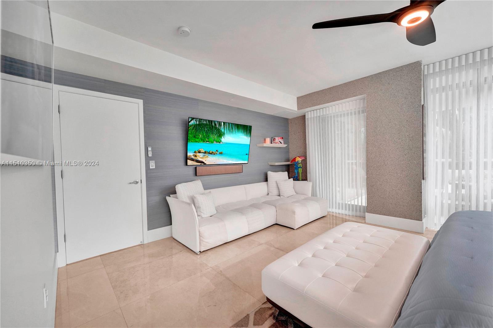 2101 South Surf Road, Unit 3C Hollywood, FL 33019 - Photo 11 of 23 a living room with furniture and a flat screen tv