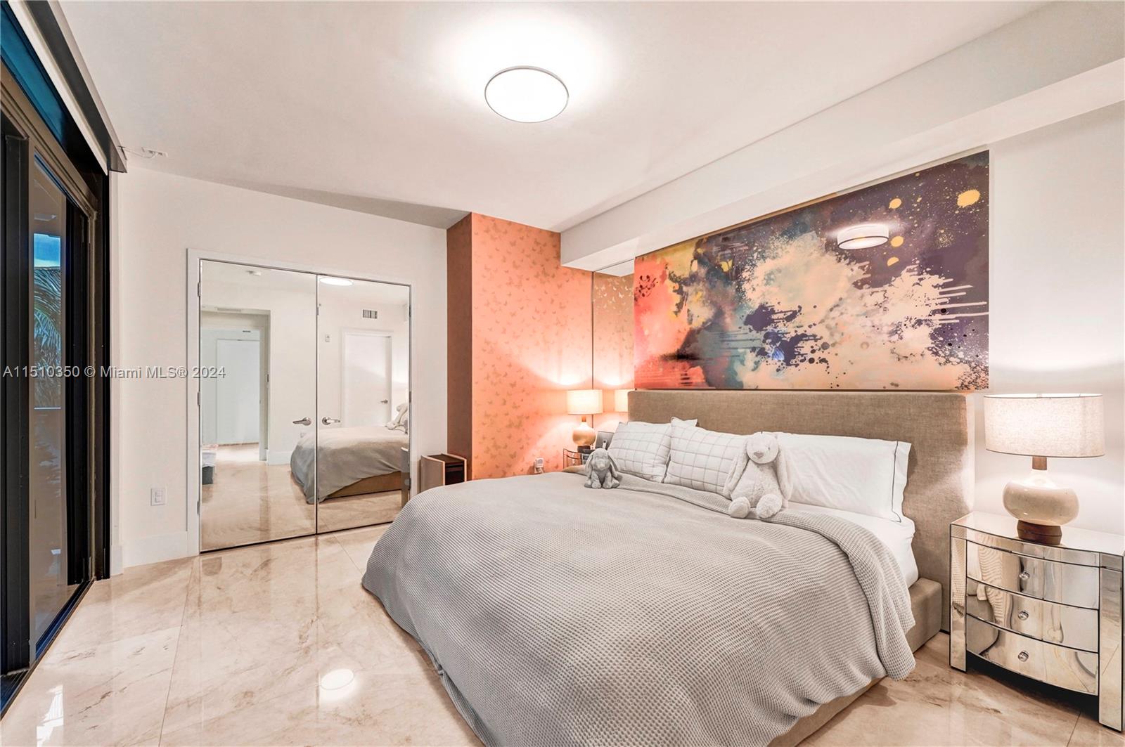 2101 South Surf Road, Unit 3C Hollywood, FL 33019 - Photo 12 of 23 a bedroom with a large bed and a couch