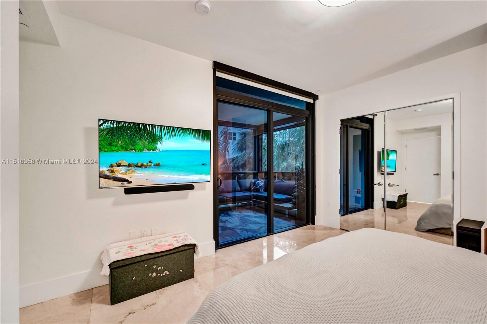 2101 South Surf Road, Unit 3C Hollywood, FL 33019 - Photo 13 of 23 a living room with furniture and a flat screen tv