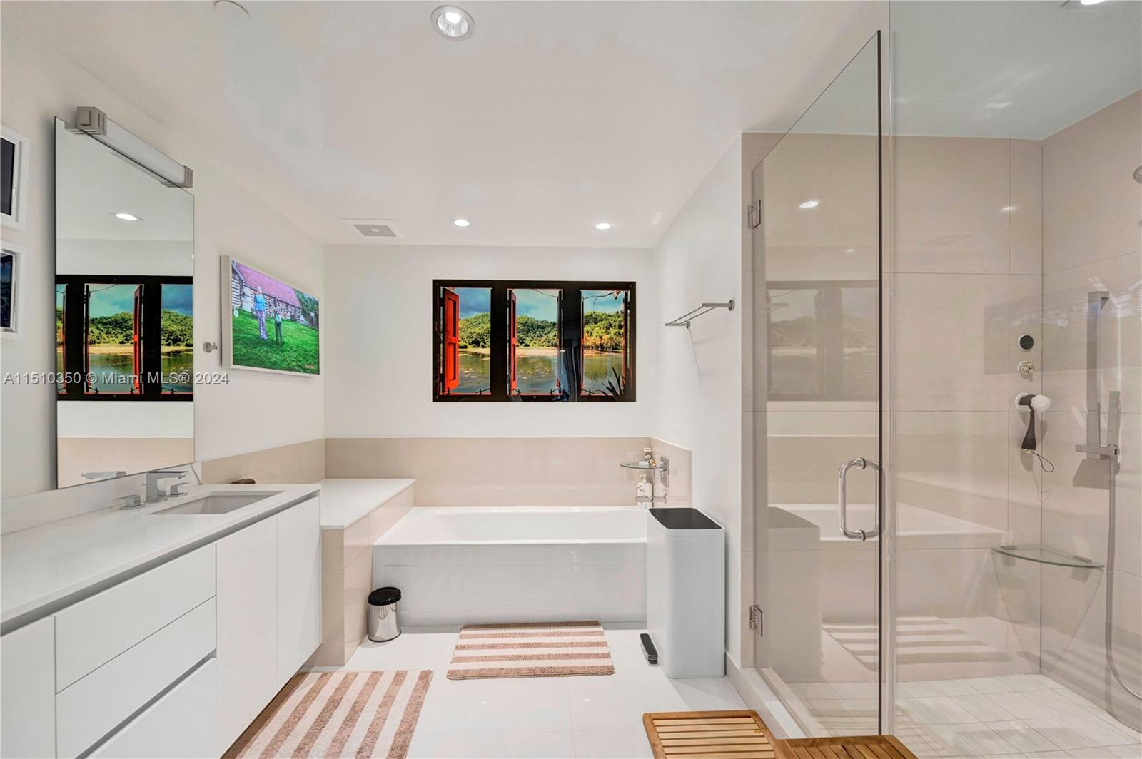 2101 South Surf Road, Unit 3C Hollywood, FL 33019 - Photo 15 of 23 a bathroom with a double vanity sink a mirror and a shower