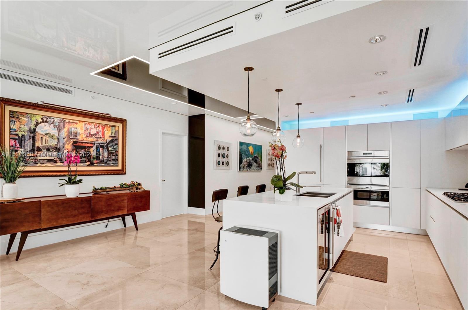 2101 South Surf Road, Unit 3C Hollywood, FL 33019 - Photo 5 of 23 a kitchen with stainless steel appliances kitchen island granite countertop a sink and a refrigerator