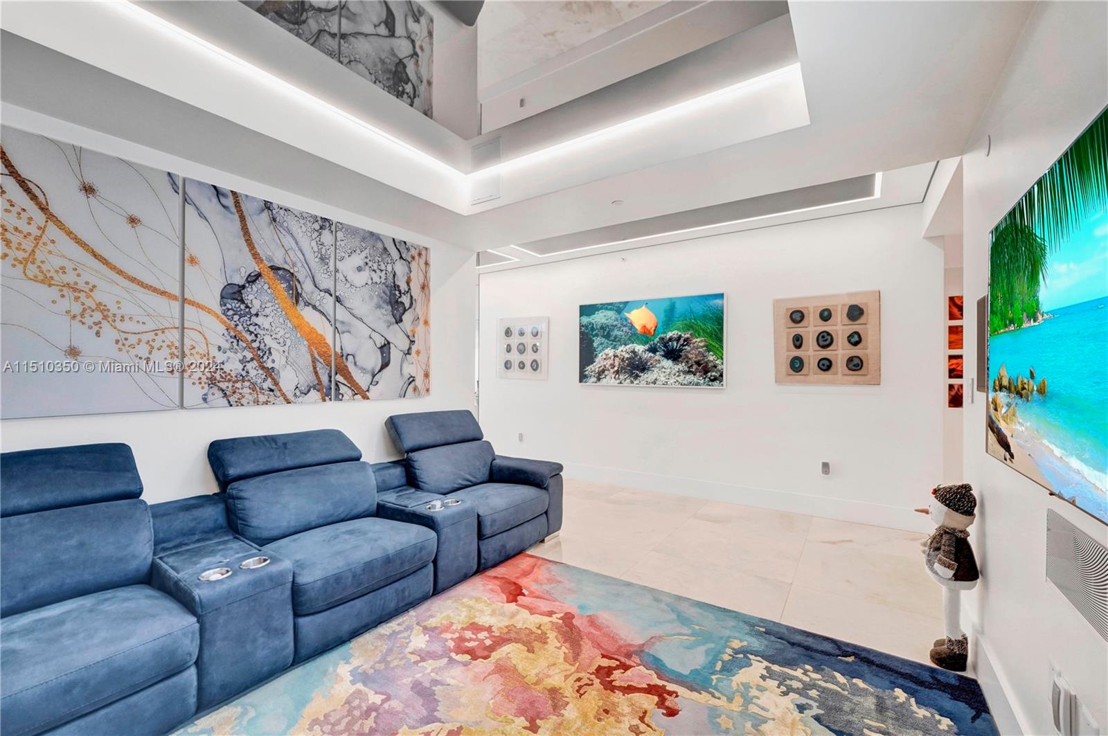 2101 South Surf Road, Unit 3C Hollywood, FL 33019 - Photo 7 of 23 a living room with furniture and a flat screen tv