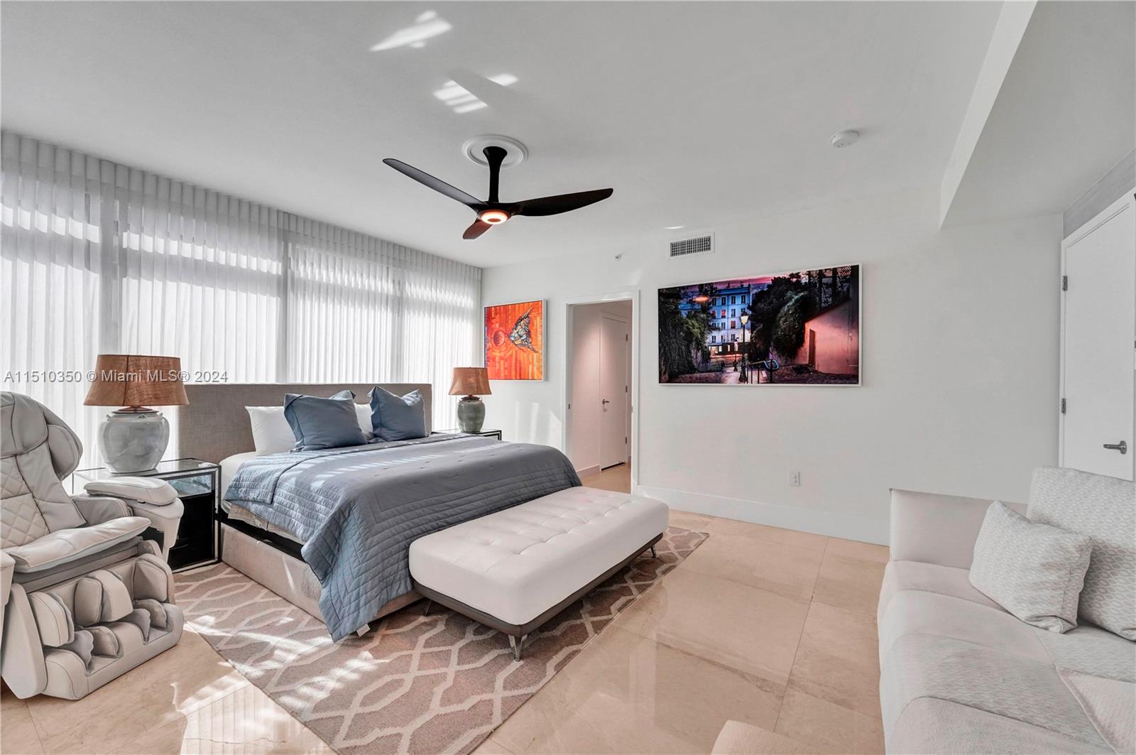 2101 South Surf Road, Unit 3C Hollywood, FL 33019 - Photo 10 of 23 a spacious bedroom with a bed and glass walk in closet