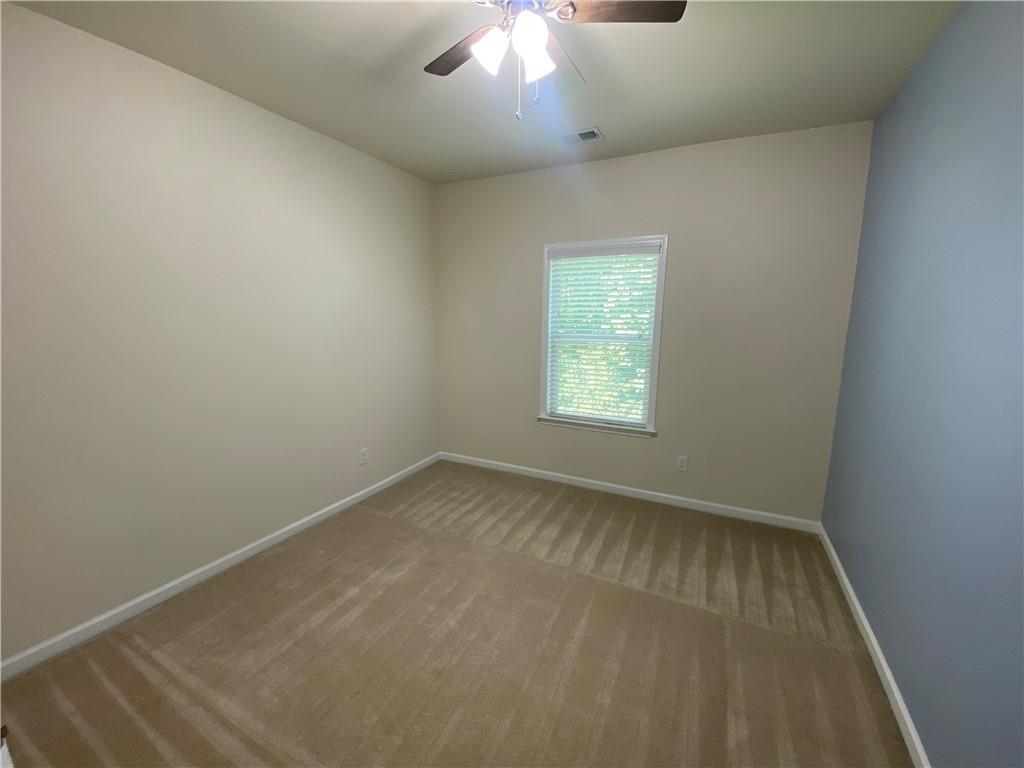 4870 Odum View Lane Cumming, GA 30040 - Photo 13 of 23 an empty room with a window