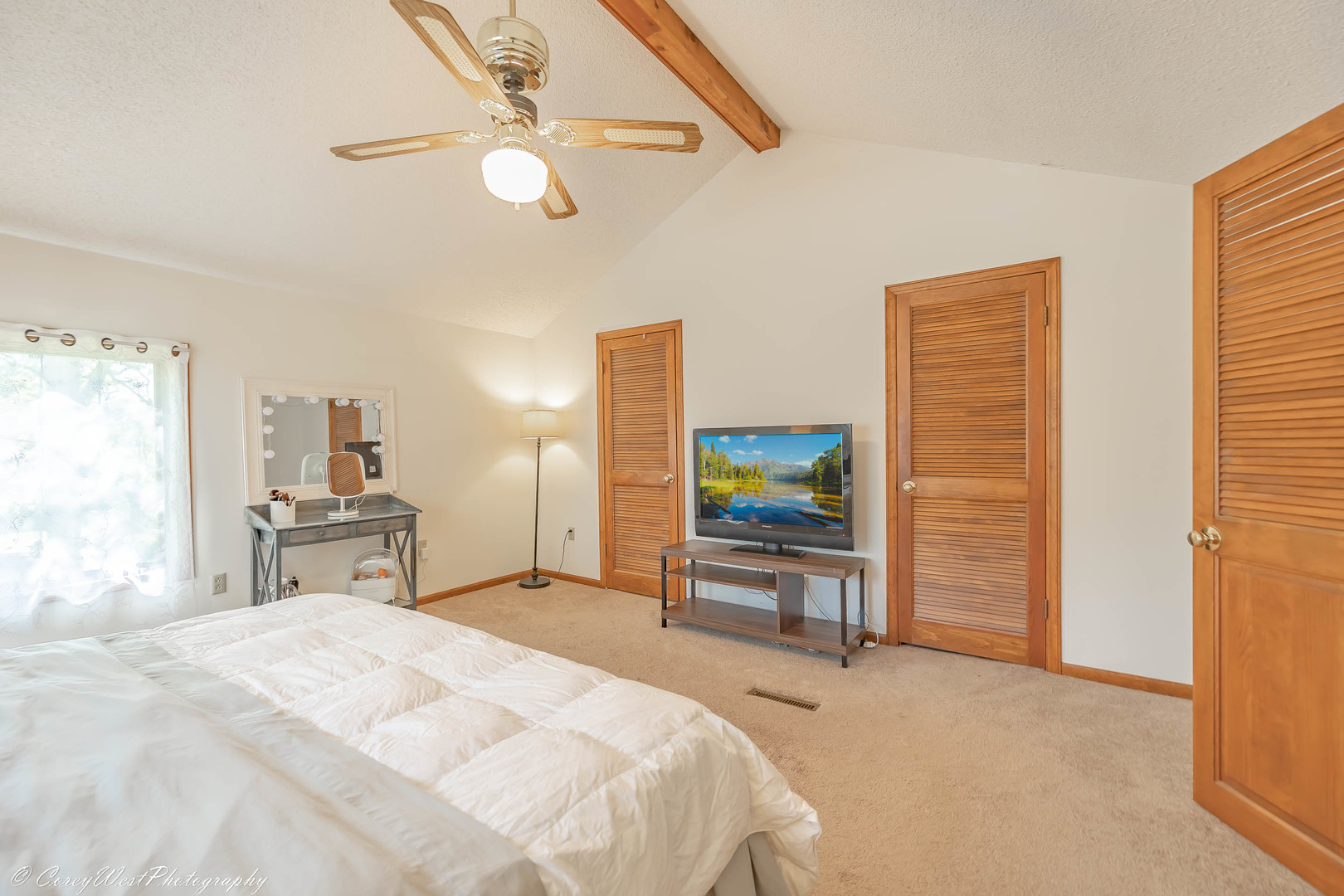 927 Thurlby Road Kingston, IL 60145 - Photo 13 of 21 a bedroom with a bed and a flat tv screen on dresser