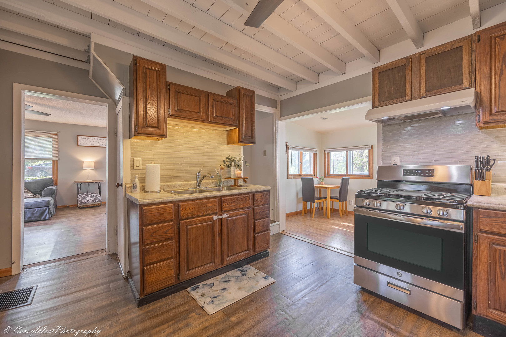 927 Thurlby Road Kingston, IL 60145 - Photo 7 of 21 a kitchen with stainless steel appliances wooden floor and a stove