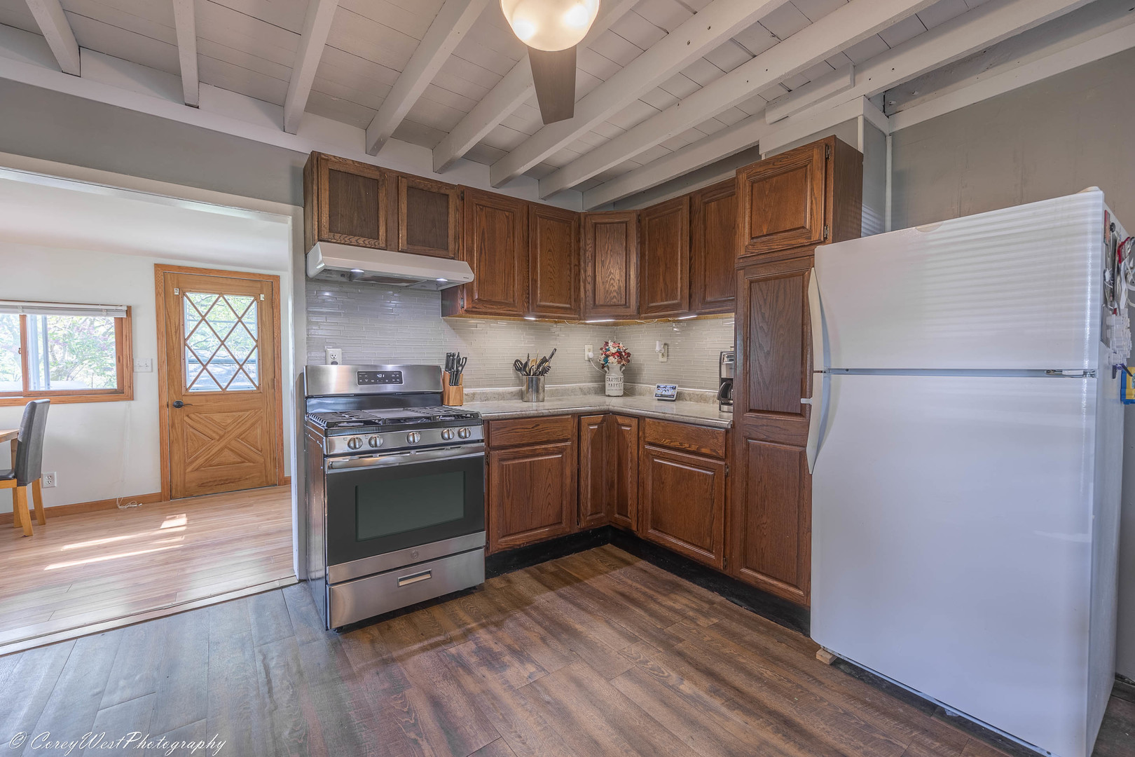 927 Thurlby Road Kingston, IL 60145 - Photo 8 of 21 a kitchen with a refrigerator and a stove top oven