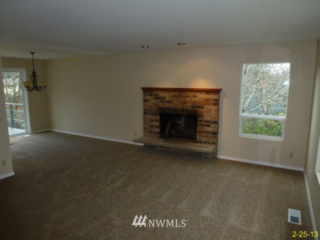 22010 7th Place West Bothell, WA 98021 - Photo 4 of 15 an empty room with a fireplace