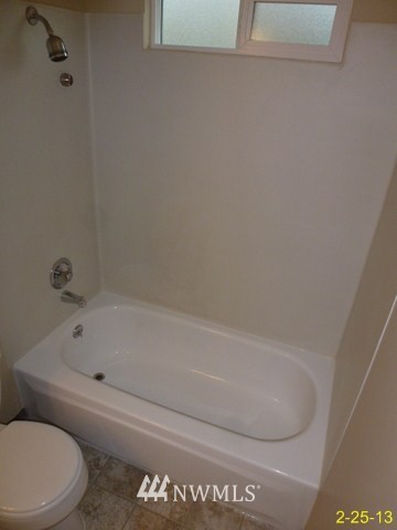22010 7th Place West Bothell, WA 98021 - Photo 7 of 15 a bathroom with a toilet and bathtub