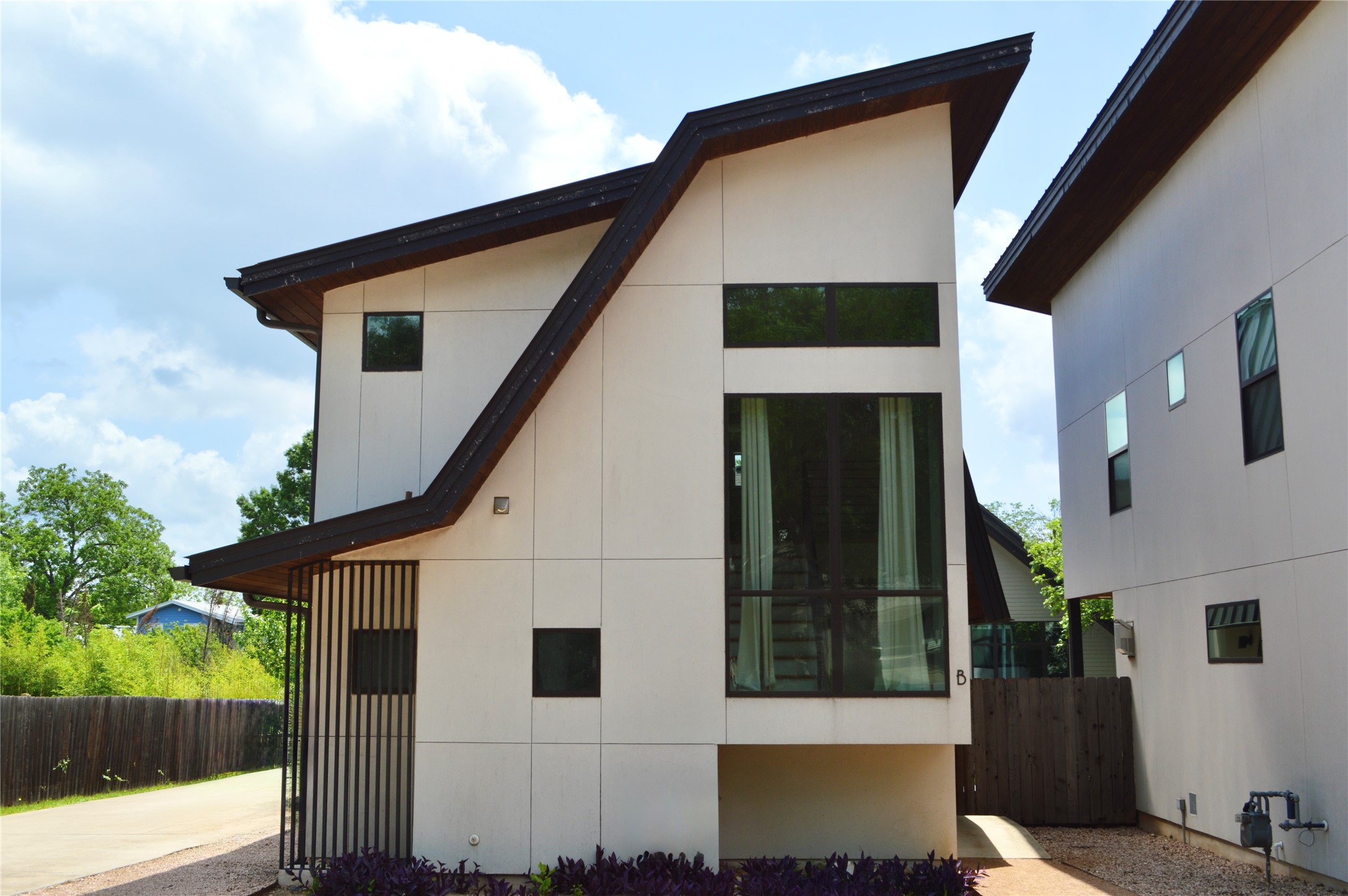 View of home's exterior featuring fence