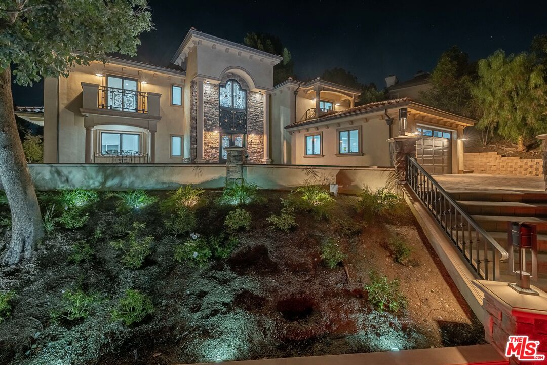 31425 Birdella Road Malibu, CA 90265 - Photo 13 of 14 a view of a residential apartment building with a yard
