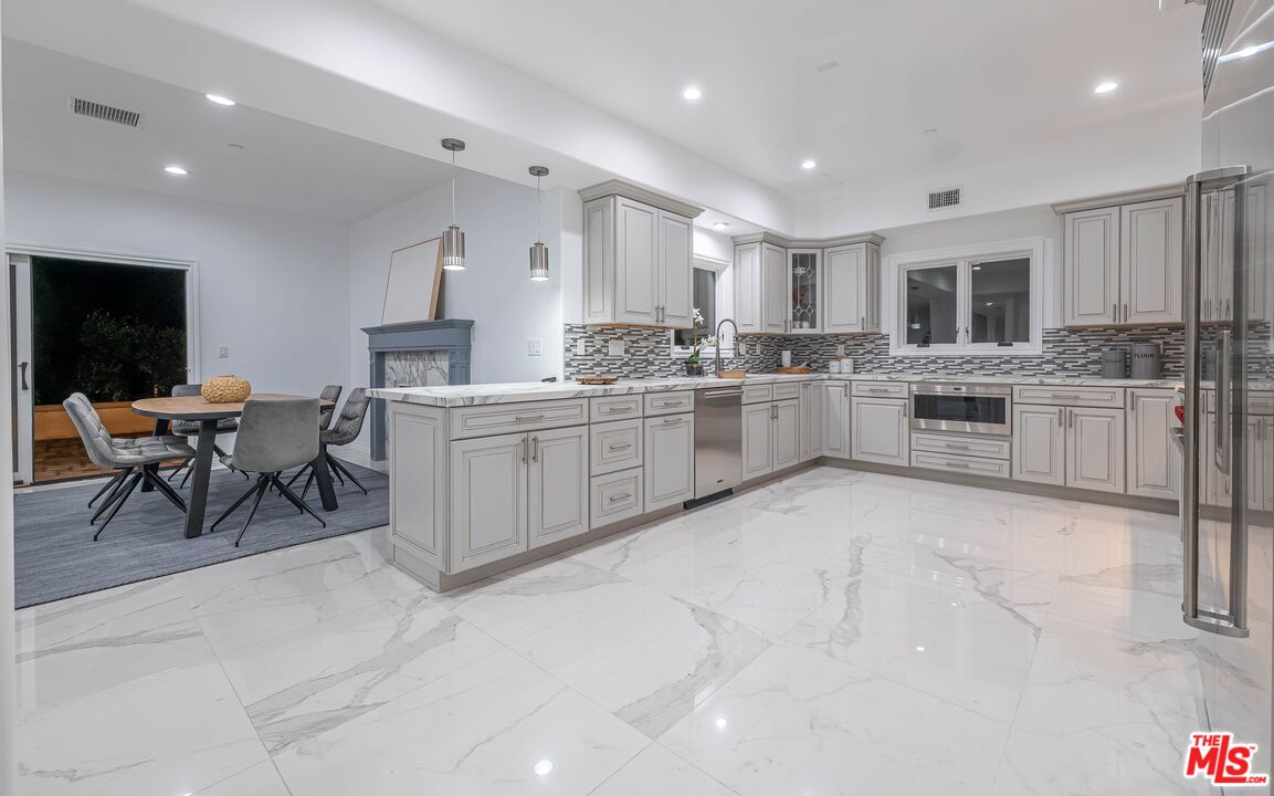31425 Birdella Road Malibu, CA 90265 - Photo 7 of 14 a kitchen with lots of counter top space and appliances