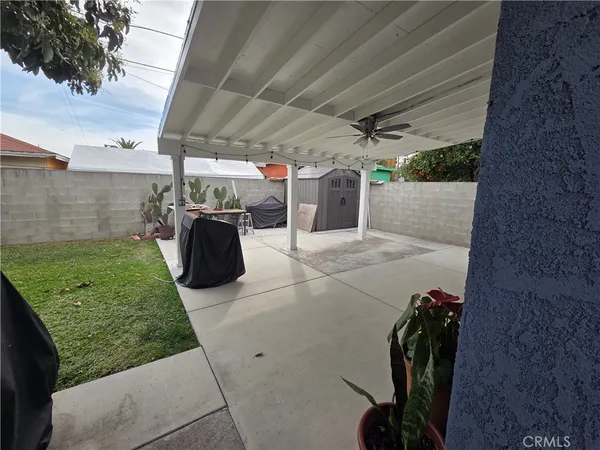 a view of a couches in patio and a yard
