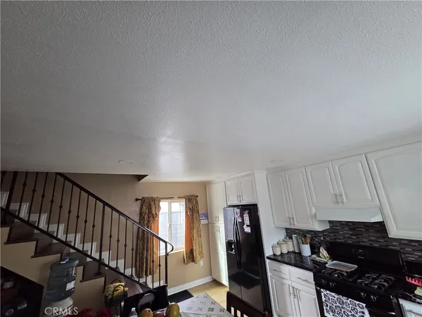 a kitchen with lots of appliances and cabinets