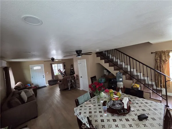 a living room with furniture and flowers