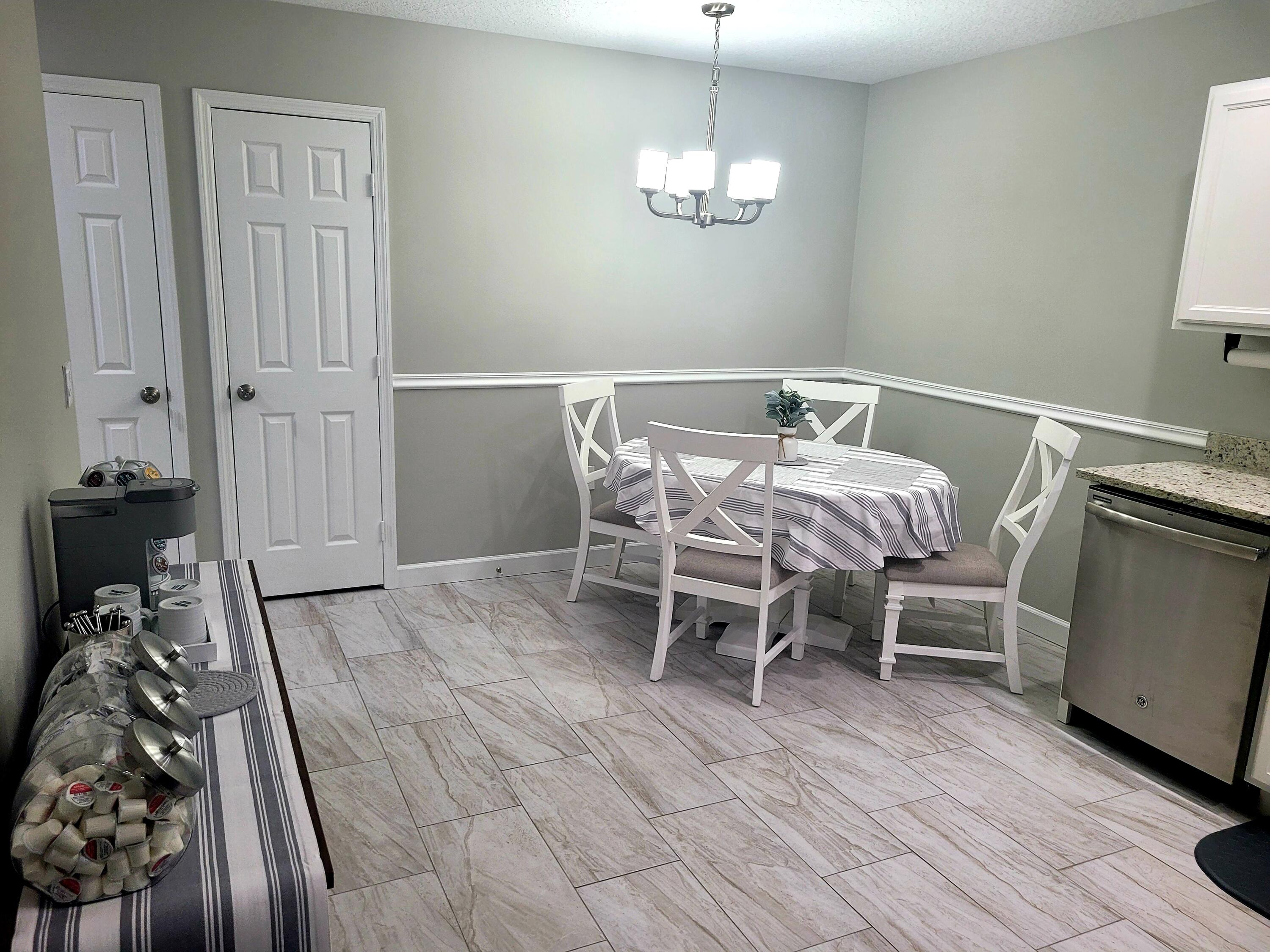 511 West Pine Street, Unit B Lantana, FL 33462 - Photo 7 of 11 a dining room with furniture and wooden floor