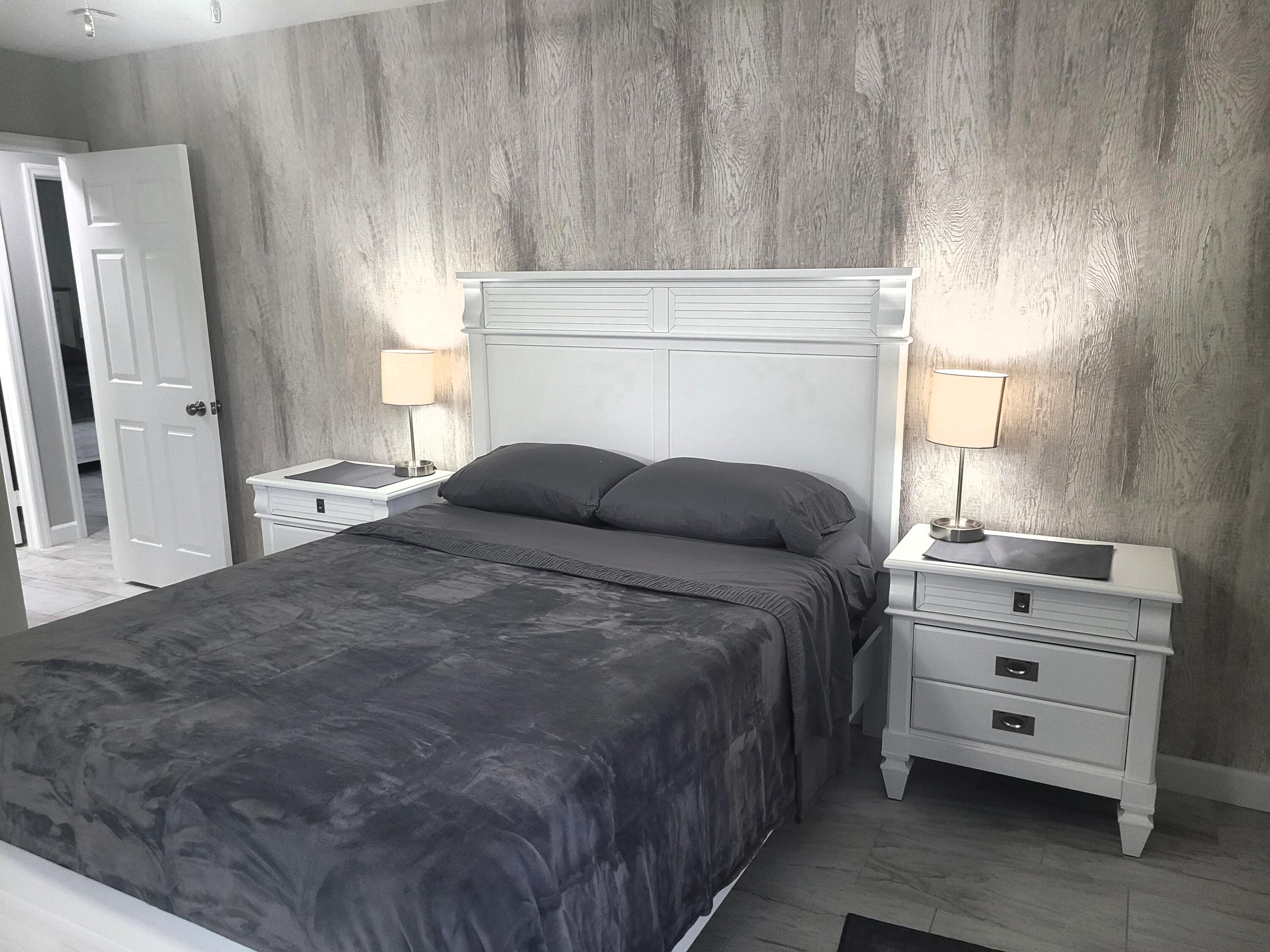 511 West Pine Street, Unit B Lantana, FL 33462 - Photo 9 of 11 a bedroom with a bed and a dresser