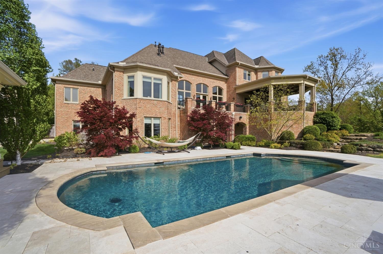 4535 Drake Road Cincinnati, OH 45243 - Photo 82 of 96 Step outside to your private oasis featuring a pool and pool house, all set against the backdrop of serene acreage and city views.