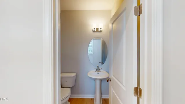 a view of a hallway with paintings on the wall