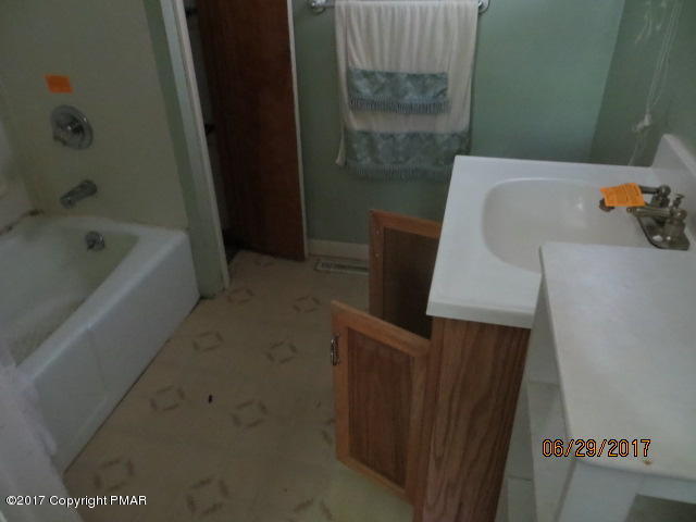 110 Firehouse Road Pocono Pines, PA 18350 - Photo 2 of 8 a bathroom with a sink and a tub
