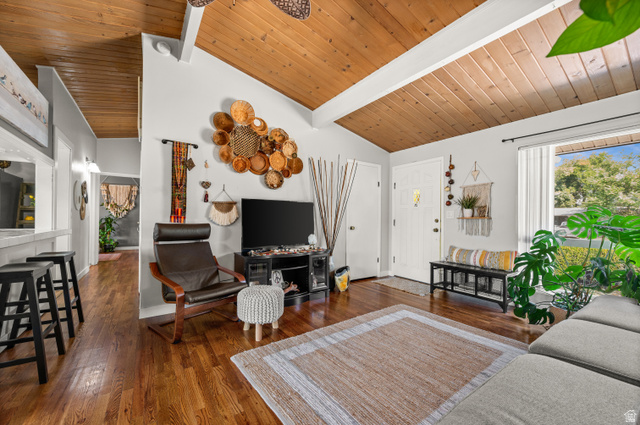 909 Rancho Boulevard Ogden, UT 84404 - Photo 6 of 27 Bright, open living area showcasing wood plank vaulted ceilings, hardwood flooring, and abundant natural light from multiple windows